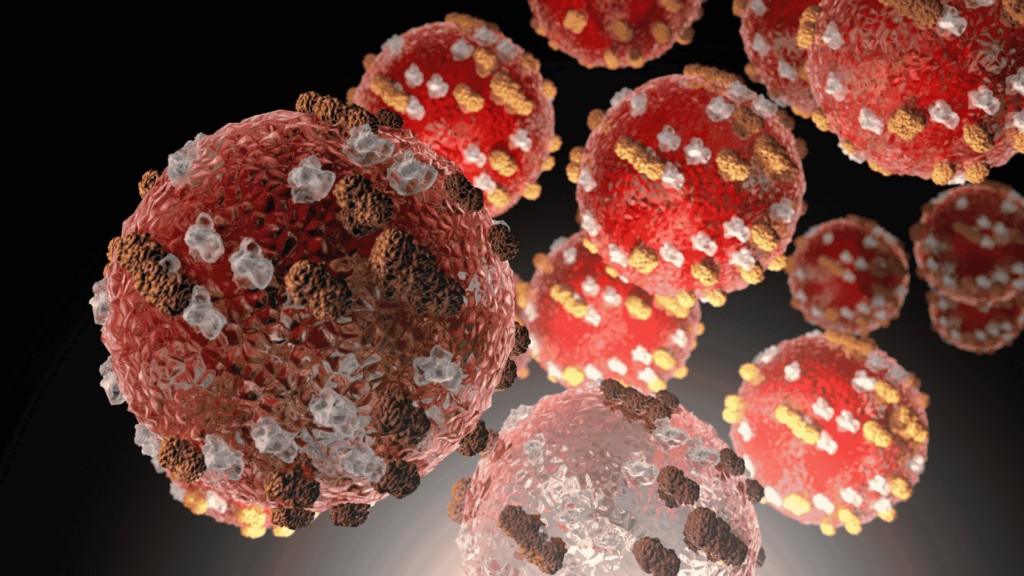 alt="Ilustración 3D del virus del sarampión mostrando su estructura altamente contagiosa en el aire"